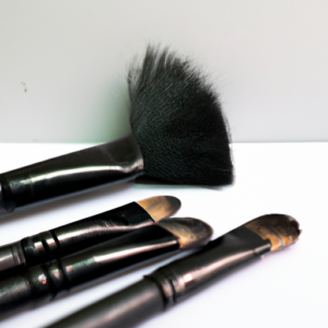 One suggestion for a thumbnail for Achieving the Perfect Smokey Eye Look could be a close-up of a makeup brush with a black and silver smoky effect.